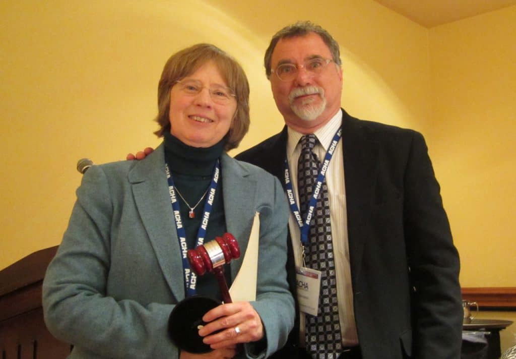 Changing of the Guard: Incoming president Daniel Bornstein presents outgoing president Maggie McGuinness, with a ceremonial gavel during the 2014 Presidential Luncheon held at the Marriott Hotel in Washington, D.C., January 4.